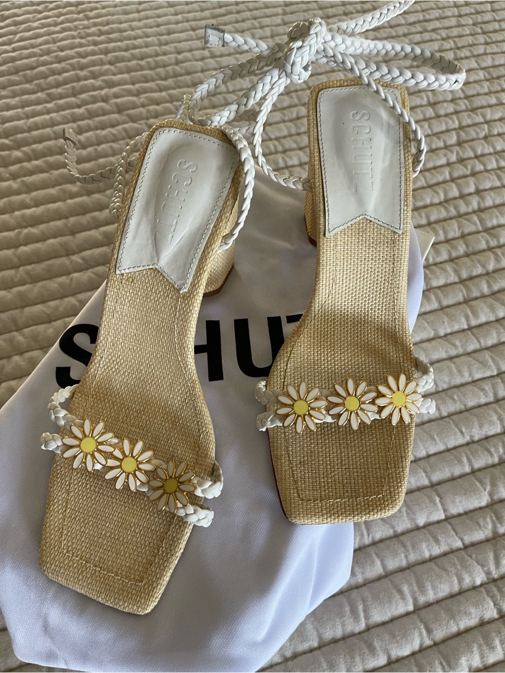 SCHUTZ White Braided Strap Sandals with Daisy detail at toe.